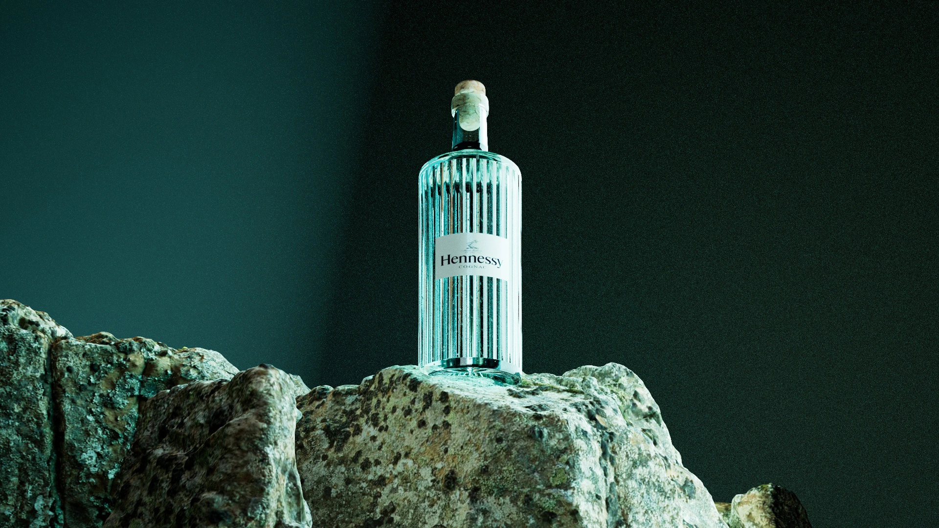 Hennessy 3D cognac bottle standing on mineral rocks with deep green lighting by Kalypt Studio