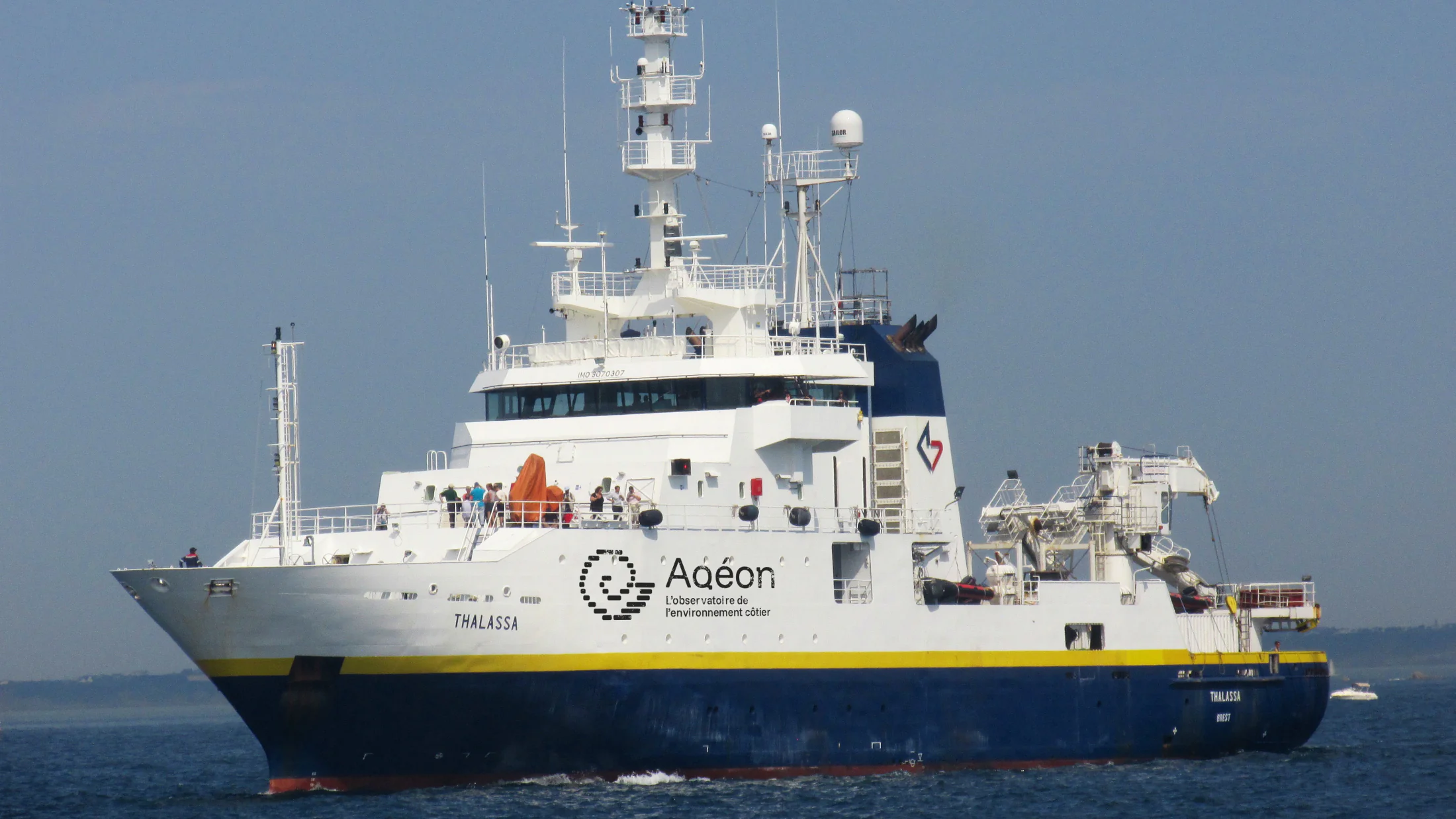 Thalassa research vessel displaying the Aqéon visual identity